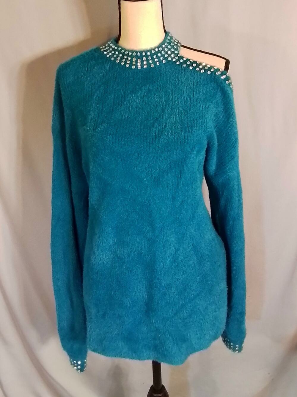Calligraphie ; Teal sweater bejeweled with diamond like beads.